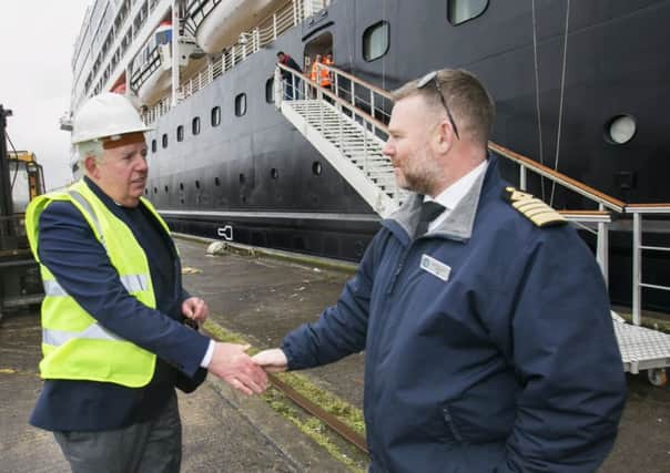 Brian McConville welcomes Carl Smith, skipper of the Azamara Pursuit, to Belfast on Wednesday