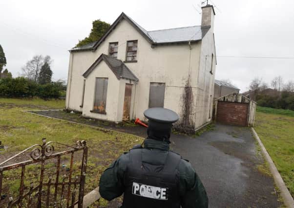 Police at the scene at a derelict property in Maghera on Friday as they launch a murder investigation into the death of Piotr Krowka.