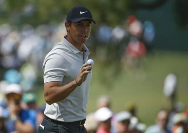 Rory McIlroy reacts to a par save on the seventh hole during the second round at the Masters on Friday.