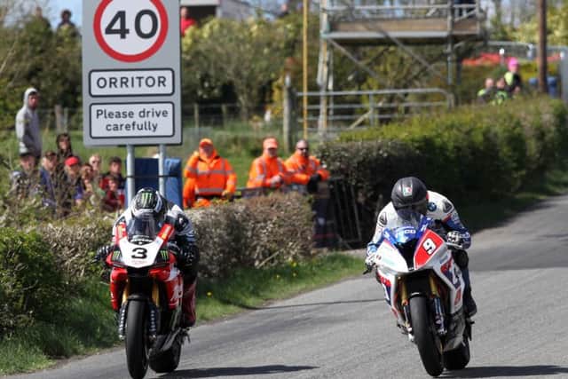 Michael Dunlop (Milwaukee Yamaha) and Guy Martin (Tyco BMW) in action at the Cookstown 100 in 2015.