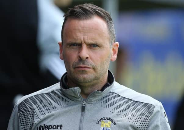 Dungannon Swifts manager Rodney McAree signed a new contract ahead of the club's 2-0 win over Carrick Rangers.