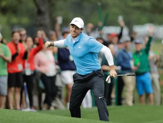 Rory McIlroy reacts after chipping in for an eagle during round three of The Masters