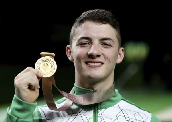 Rhys McClenaghan proudly shows off his Commonwealth gold medal