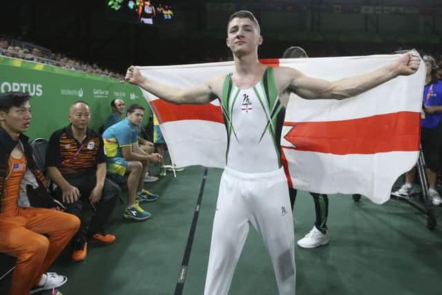Flying the flag for NI following his gold medal win in Australia, Rhys McClenaghan savours the moment