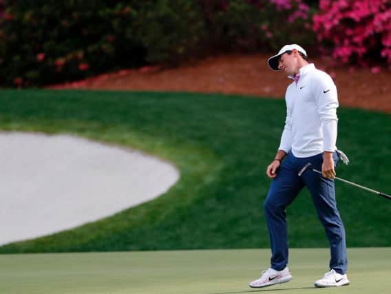Rory McIlroy reacts after missing a putt during the final round of The Masters