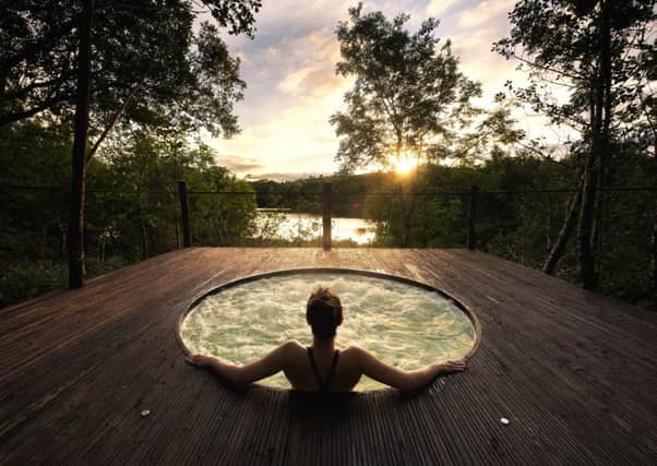 The hot tub with stunning views of the lake