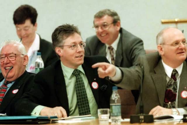 The DUP members, (from left)  Dr Ian Paisley, Peter Robinson and Rev William McCrea 'laugh off' comments by Lord Alderdice during their campaign against the Belfast Agreement