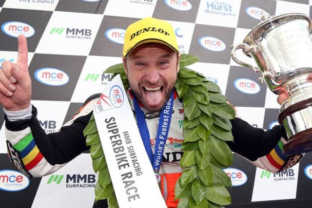 Bruce Anstey celebrates his victory in the Superbike race at last year's Ulster Grand Prix.