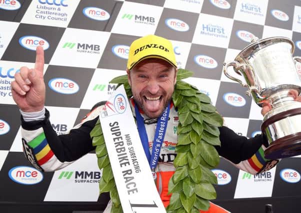 Bruce Anstey celebrates winning the feature Superbike race at the Ulster Grand Prix in 2017.