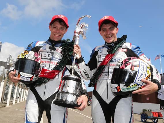 Ben and Tom Birchall celebrate after winning both Sidecar races at last year's Isle of Man TT.