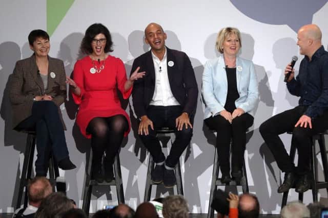 Politicians Caroline Lucas, left, Layla Moran, Chuka Umunna, and Anna Soubry are joined onstage by comedian Andy Parsons, right, during the People's Vote campaign launch on Brexit at the Electric Ballroom in Camden Town