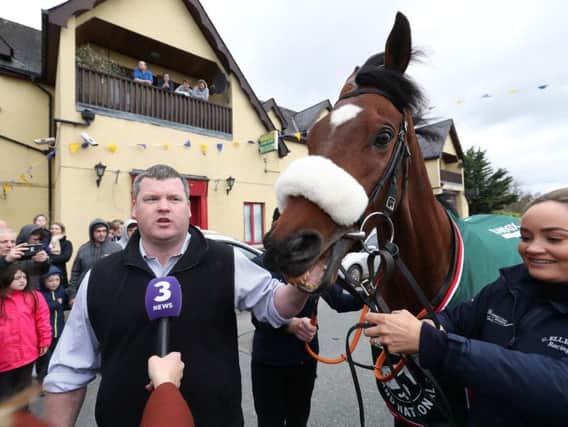 Trainer Gordon Elliot and Grand National Winner Tiger Roll are interviewed during their homecoming parade through Summerhill Village, County Meath