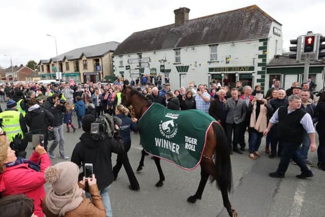 Trainer Gordon Elliot and Grand National Winner Tiger Roll during the homecoming parade through Summerhill Village, County Meath
