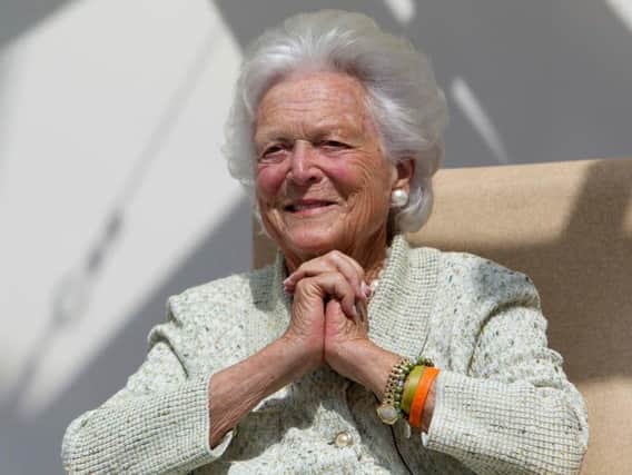 former first lady Barbara Bush listens to a patient's question during a visit to the Barbara Bush Children's Hospital at Maine Medical Center in Portland, Maine.