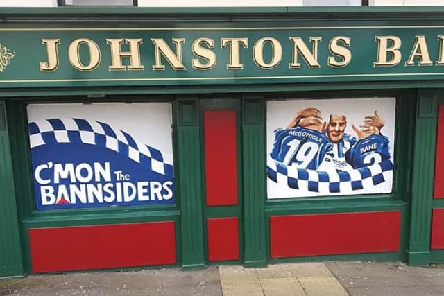 One of the local bars in Coleraine, the Railway Arms (Johnston's Bar), which has decorated its windows for the Irish Cup final.