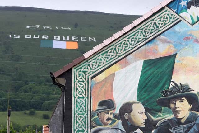 A gigantic tricolour with the message Eriu is our Queen on Black Mountain, Belfast, created to co-incide with the visit of the UKs head of state in 2012. Owen Polley argues that in a united Ireland, a British cultural identity may live on  but our home would become a foreign country