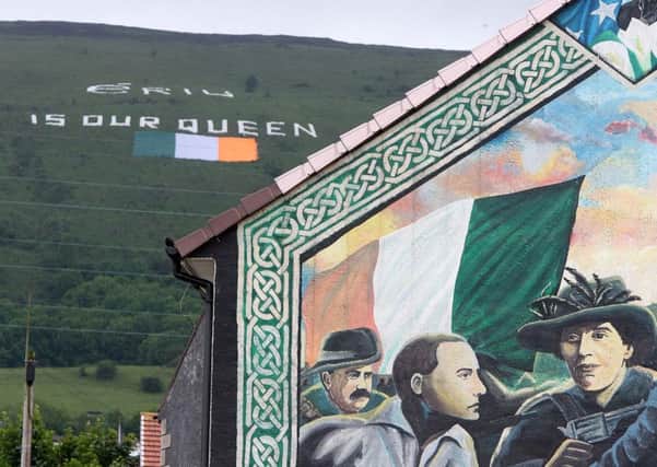 A gigantic tricolour with the message Eriu is our Queen on Black Mountain, Belfast, created to co-incide with the visit of the UKs head of state in 2012. Owen Polley argues that in a united Ireland, a British cultural identity may live on  but our home would become a foreign country