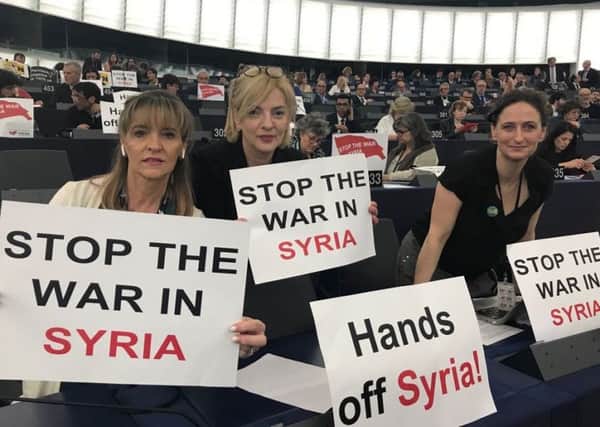 Sinn Fein MEP's Martina Anderson, Liadh NÃ­ Riada and Lynn Boylan hold a protest in the European Parliament in Strasbourg.