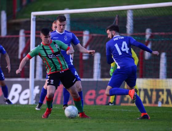 Glentoran's Alex O'Hanlon can't get past the Dungannon defence during Tuesday evening's game at the Oval.