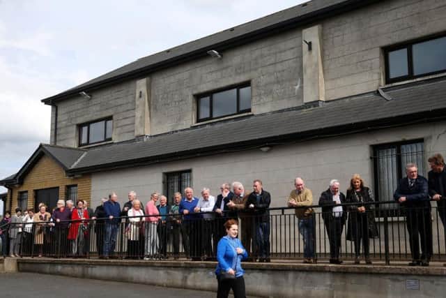 People queue to pay their respects to singer Big Tom McBride at Oram Community Centre in the Parish of Castleblayney, Co Monaghan, where his remains are lying in repose.
