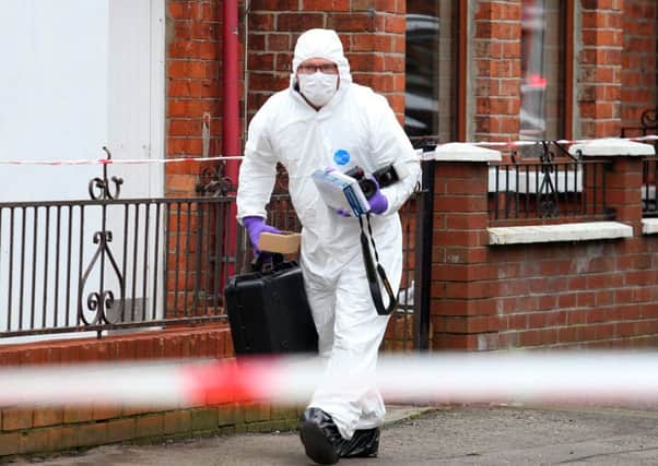 A police forensic officer at the scene