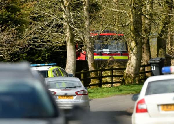 Police and fire service vehicles pictured at the scene of the plane crash in Co Antrim