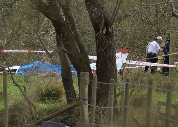 Emergency services at the scene , after a light aircraft crash at Nutts Corner, County Antrim.