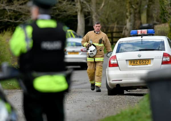 Emergency services personnel pictured at the scene of the crash