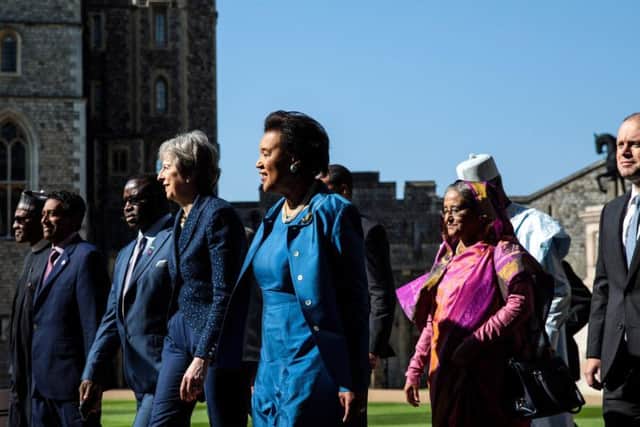 Prime Minister Theresa May (centre left) walks with commonwealth leaders at Windsor Castle during the Commonwealth Heads of Government Meeting