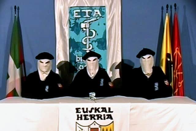 Basque separatist group ETA issuing a statement in 2011 saying it was ending its armed campaign. (AP Photo/Basque Television, File)
