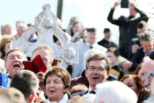 Singers Daniel O'Donnell and his sister Margo take part in a sing song on the grounds of Saint Patrick's Church in Oram, County Monaghan, after the funeral of country music star Big Tom McBride