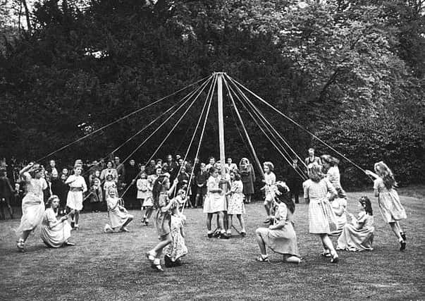 "Fairs, communal meals and parades, and children danced around a maypole."