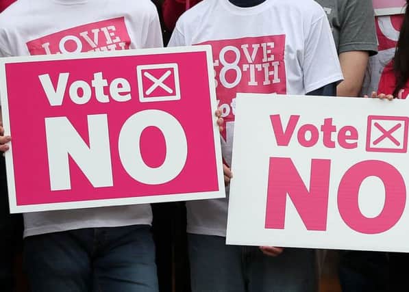 Campaigners hold Vote No placards in the Republic's campaign on the Eighth Amendment, which will be held on May 25.
Photo: Brian Lawless/PA Wire