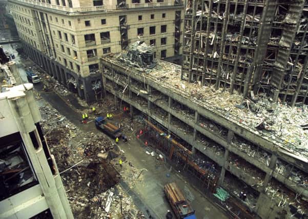 The devastation of the Hong Kong and  Shanghai Bank and the crater left in Bishopsgate (left, foreground) in London after the massive IRA bomb blast