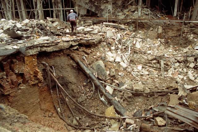 THE CRATER LEFT IN BISHOPSGATE , IN THE
CITY OF LONDON, AFTER BOMB CONCEALED IN
TIPPER TRUCK WENT OFF IN THE CITY.