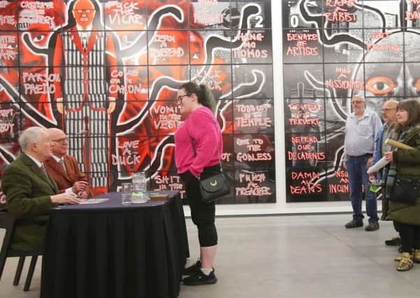Artists Gilbert and George, left, meet the public in January at the MAC theatre in Belfast at the opening of their exhibition 'Scapegoating Pictures,' which has now closed.  


Picture by Jonathan Porter/PressEye