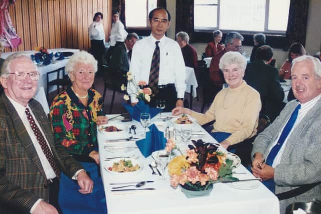 The Japanese Consul with some guests at a a Japanese-themed lunch at the old college