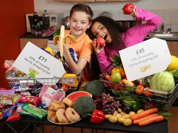 Undated handout photo issued by the Food Standards Agency and Safefood PR of children posing with various foods.