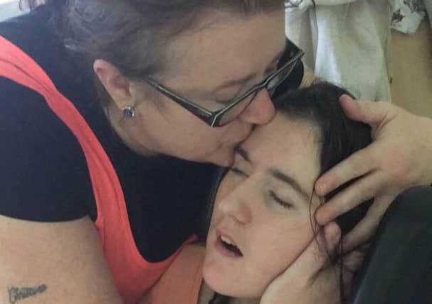 Carol Corr hugs her daughter Joleen