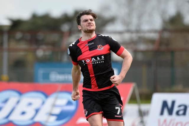 Crusaders midfielder Philip Lowry celebrates scoring their equaliser at the Ballymena Showgrounds.