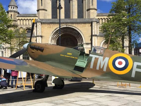 A full-scale replica Spitfire bearing the name Down (after Co Down) is displayed outside St Anne's Cathedral, ahead of an event marking the RAF's centenary at St Anne's Cathedral in Belfast