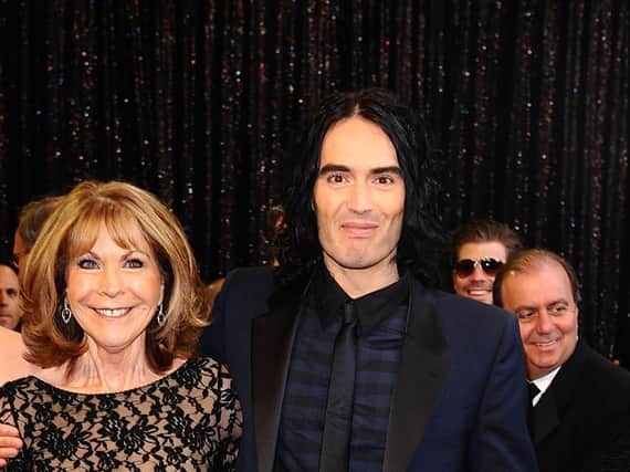 File photo dated 27/02/11 of Russell Brand and his mother Barbara, who was rushed to hospital after being badly injured in a hit-and-run car crash. The comedian has cancelled the rest of his tour following his mother's accident - saying she had sustained "numerous, life-threatening injuries".