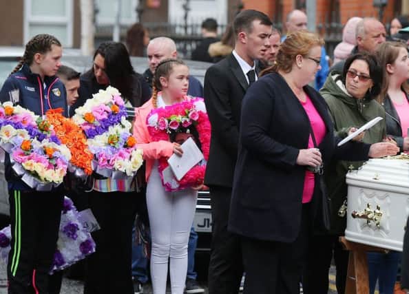 Mourners at the funeral of Joleen Corr at St Paul's Church on the Falls Road in west Belfas