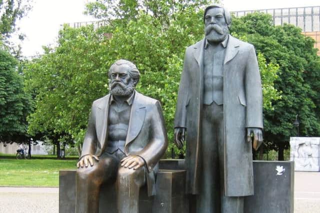 The statue near Alexanderplatz in Berlin of Karl Marx (seated) and Friedrich Engels