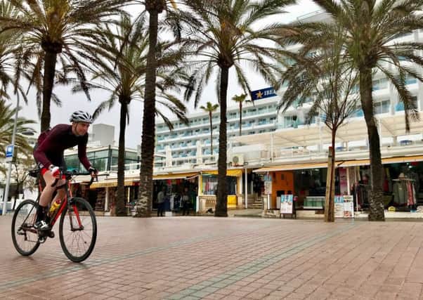 Ben cycling along the promenade in Palma