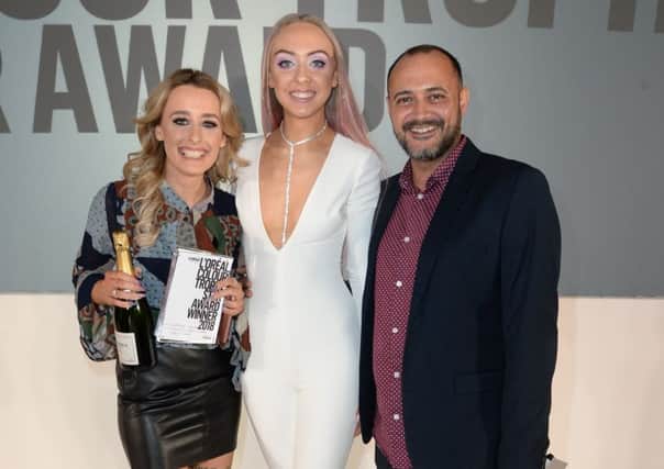 Aisling O'Hare (left), a colourist at Naked Hair in Dromara, will represent Northern Ireland at the L'Oreal Colour Trophy 2018 grand final in London next month. She is pictured with model Whitney Lesie and competition judge Nathan Walker.