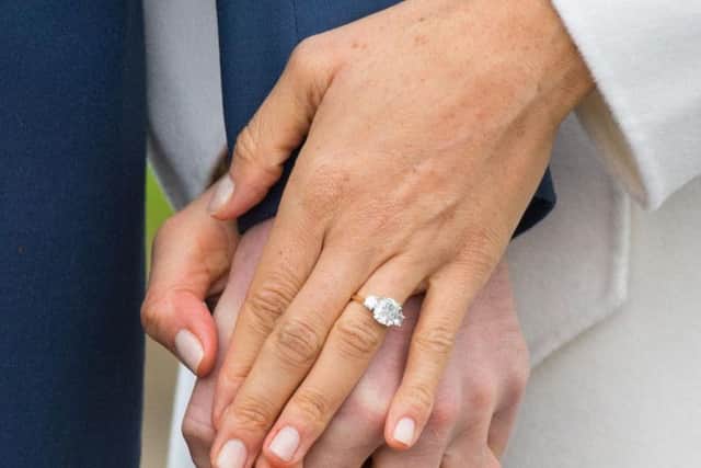 Meghan Markle's hand, as Argos have produced a replica of Meghan Markle's engagement ring for just 14.99