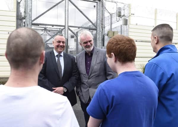 Tim McGarry, centre, with staff and inmates from Maghaberry Prison this week