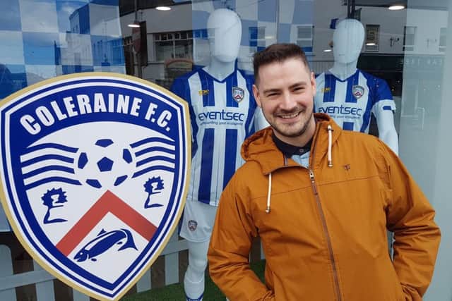 Daniel Maguire, manager of Burns Outfitters, has emblazoned his shop window with Coleraine FC colours