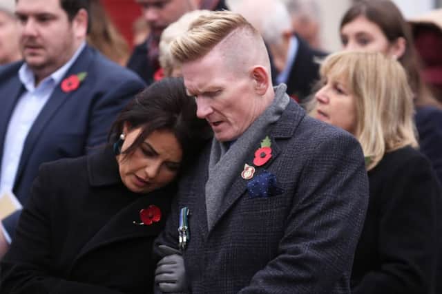 Stephen Gault, who lost his father Samuel Gault in the Enniskillen Poppy Day bomb remembers with his wife Sharon during the service at the unveiling and dedication of the memorial for the victims in November 2017. Presseye